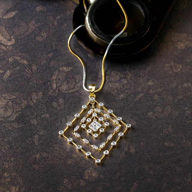 some gold jewelry and some sunglasses on a table