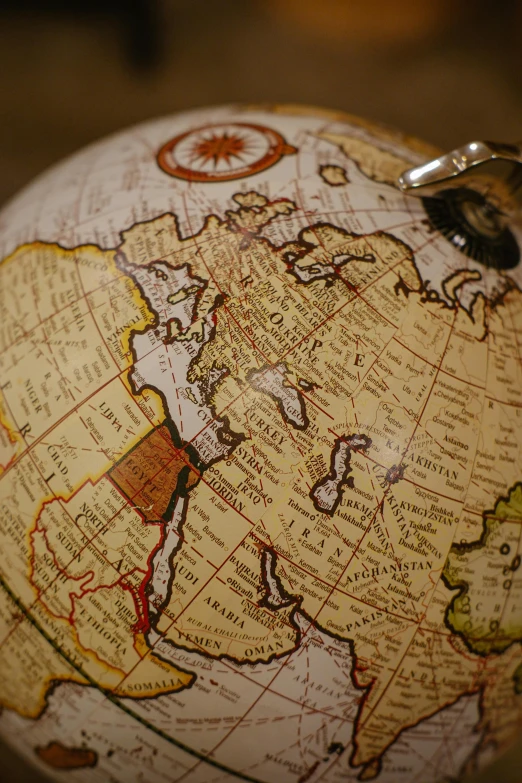 a small globe with some other writing on it