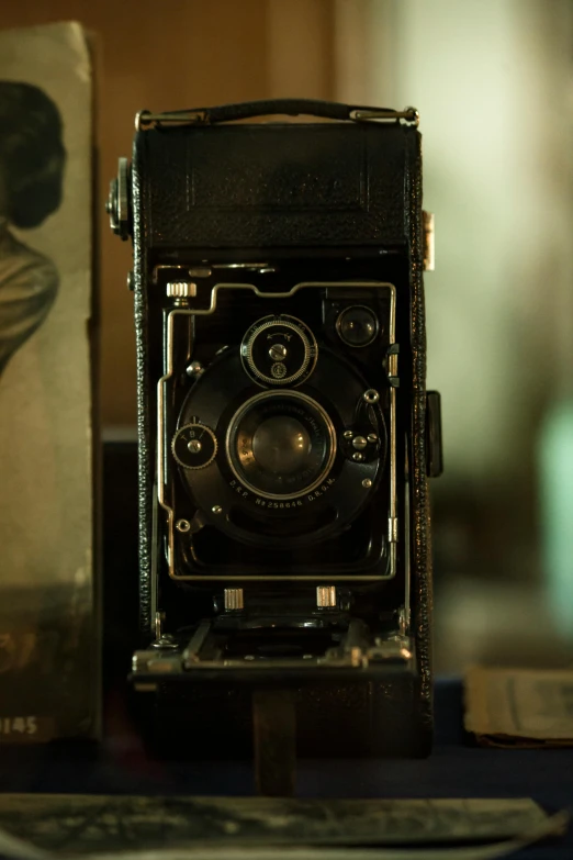 an old fashioned po camera sitting on a table