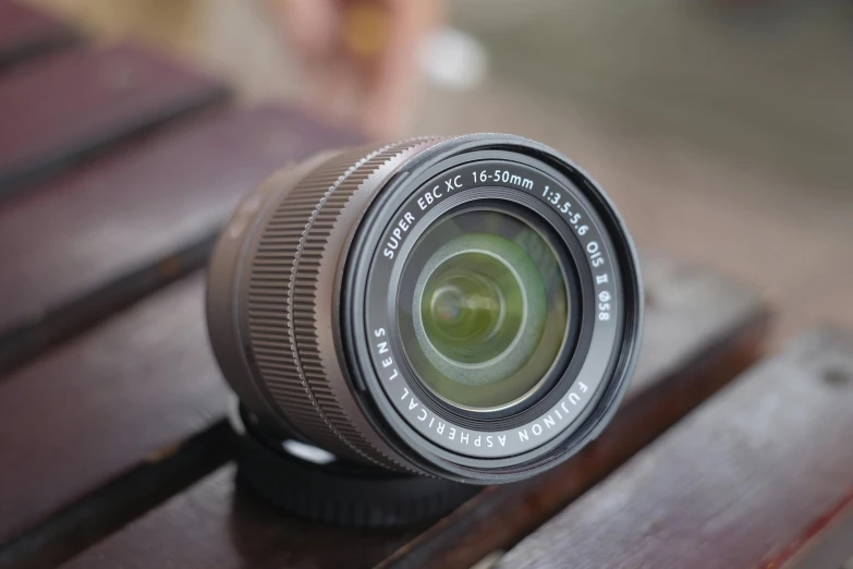 an image of a lens on a wood table