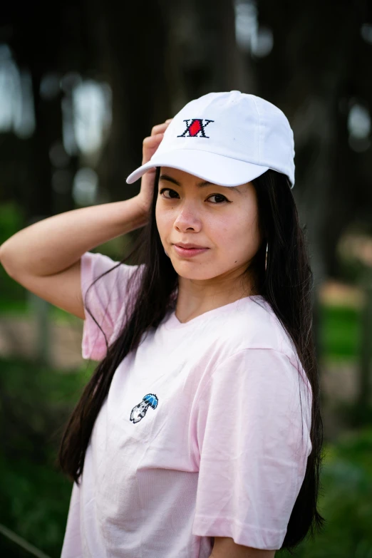 a girl poses for the camera in the park