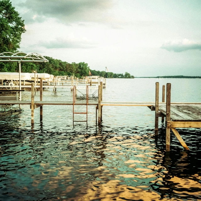 two wooden docks that are next to the water