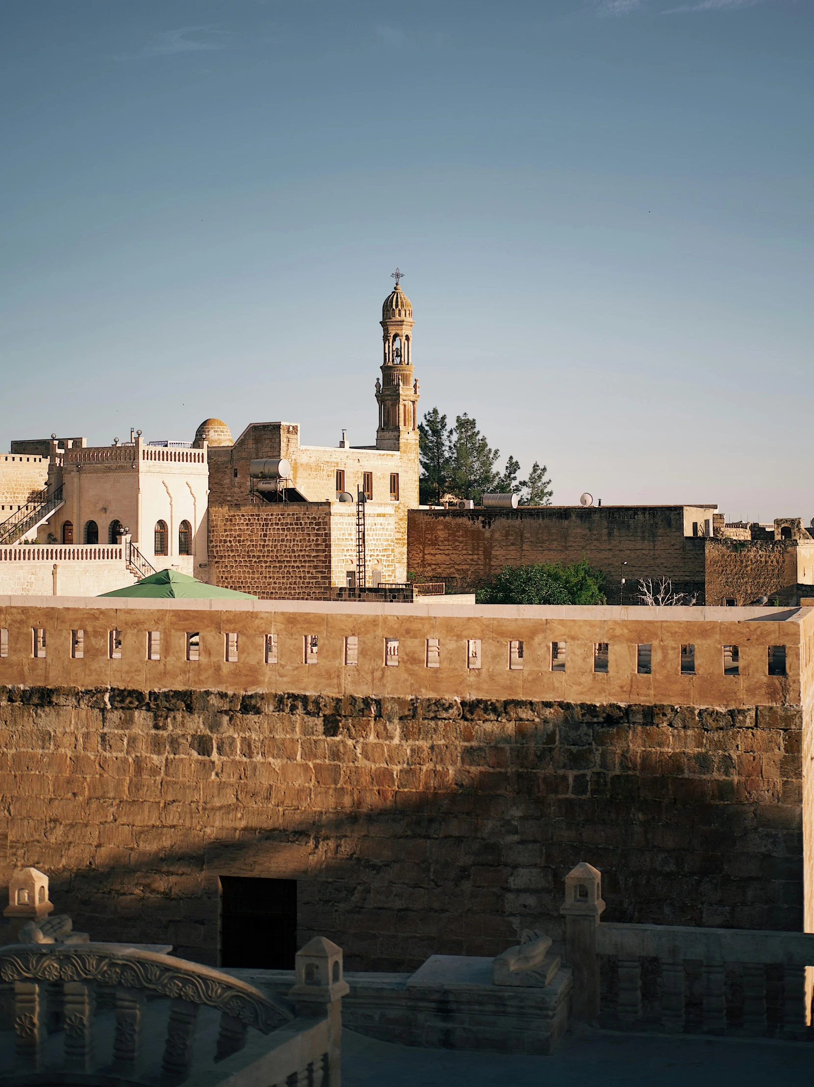 an old city wall with a clock tower