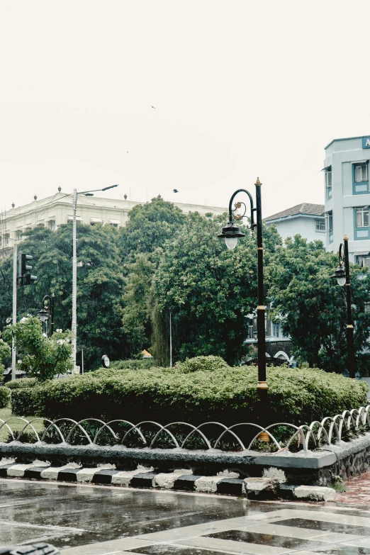 a clock on the top of a tower with some buildings