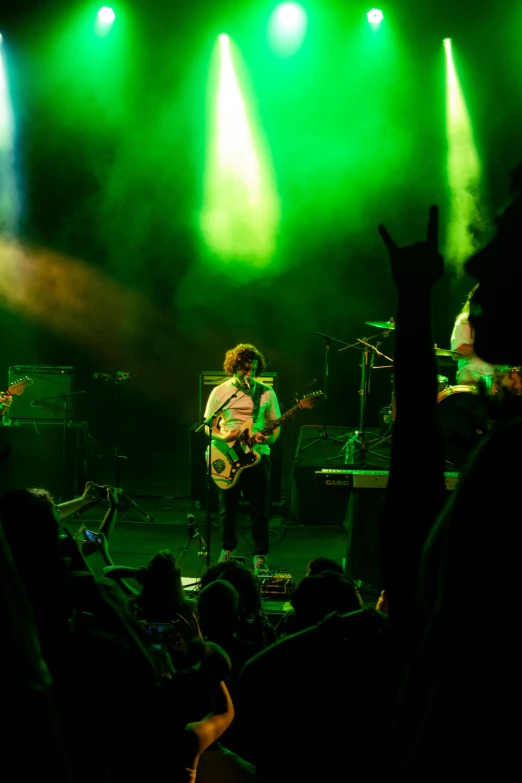 a band plays on stage during a show