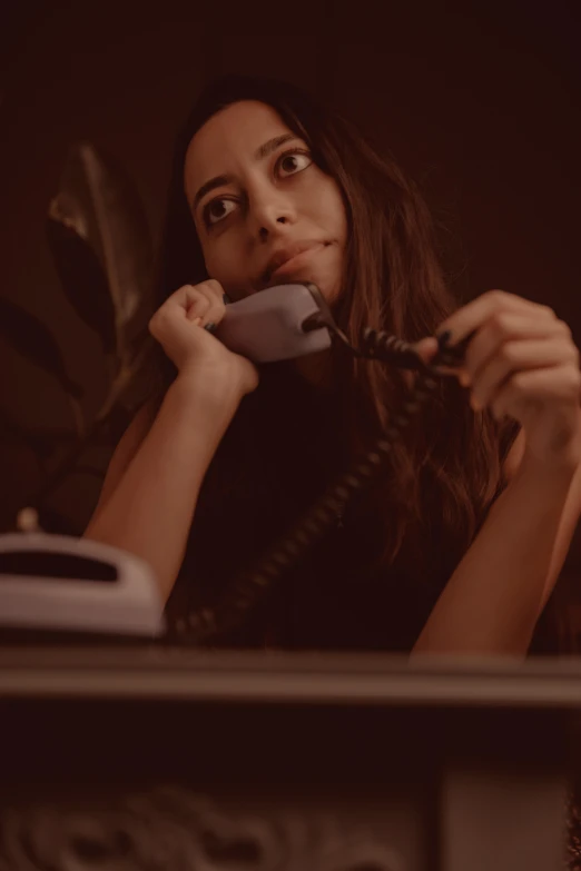 a woman with a telephone in her hands