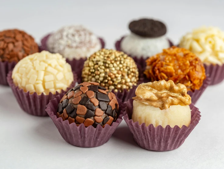 there are several different desserts sitting together on a table