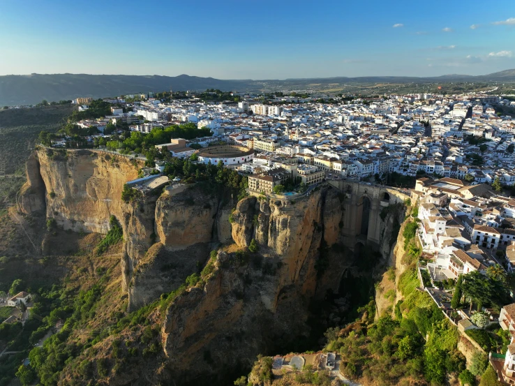 an aerial view of a small town built on top of cliffs