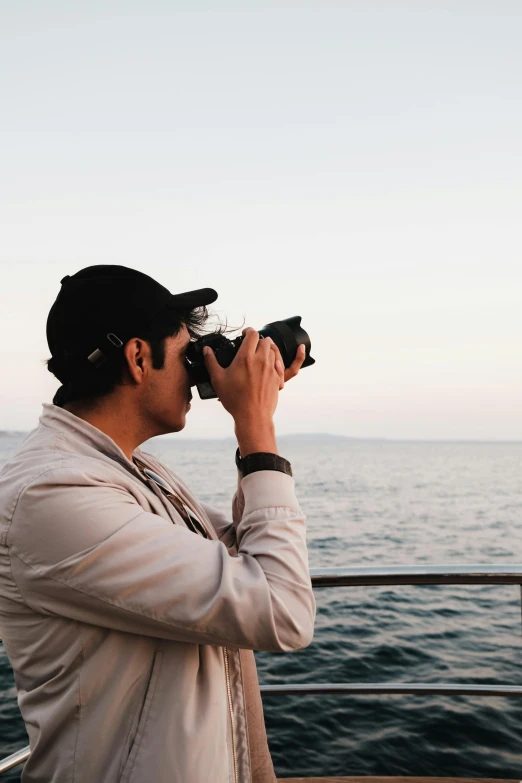 a person standing near the ocean looking into some water