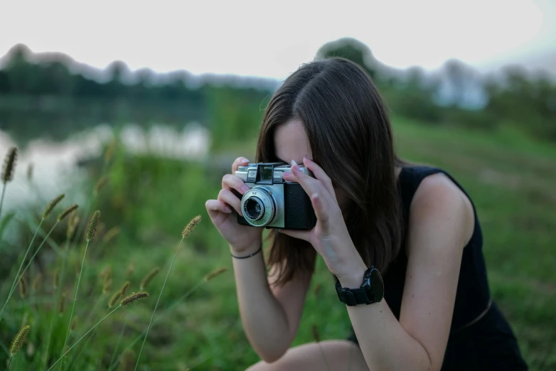 a woman is taking a po with her camera