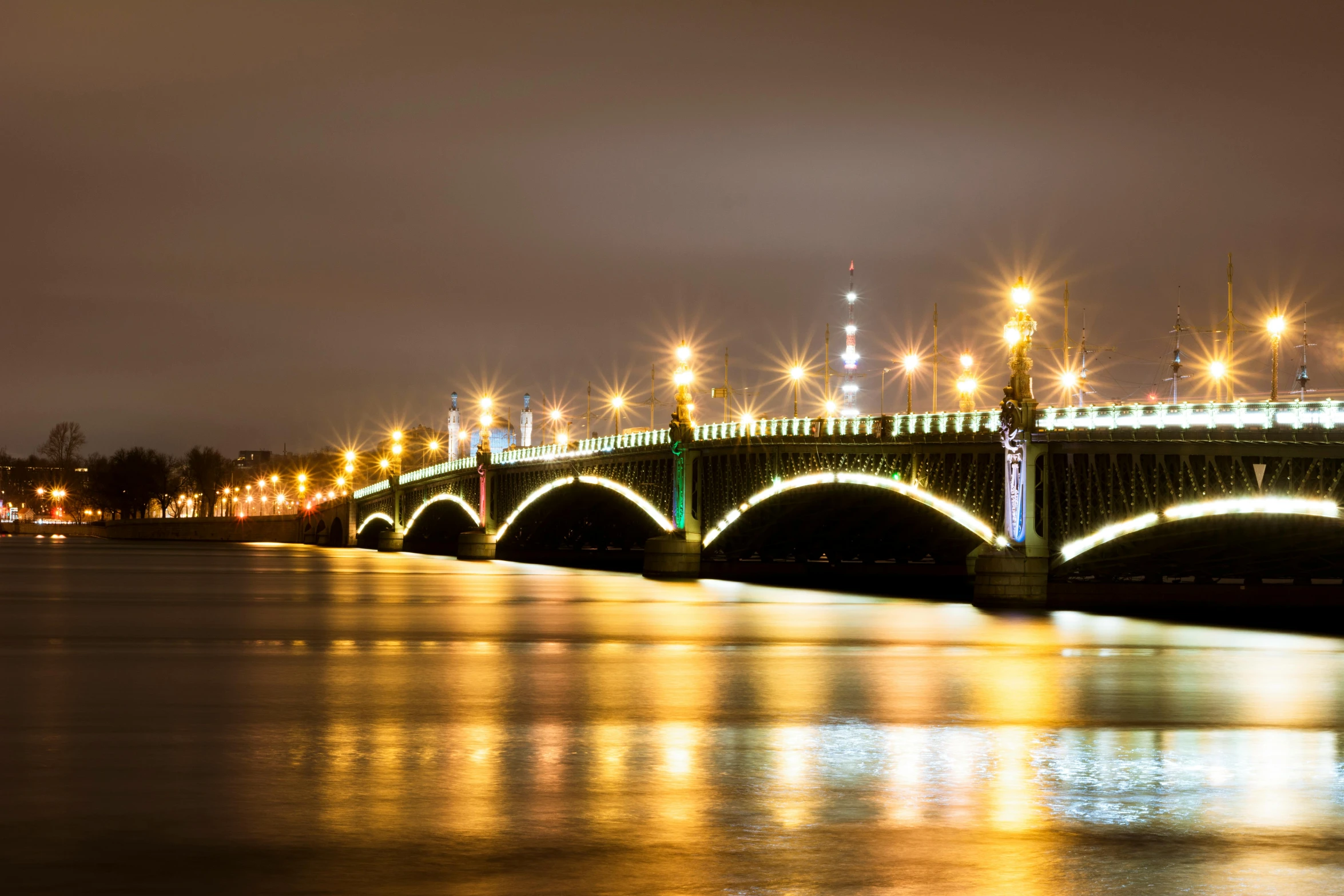 a view of a bridge, light, and the surrounding area in an image