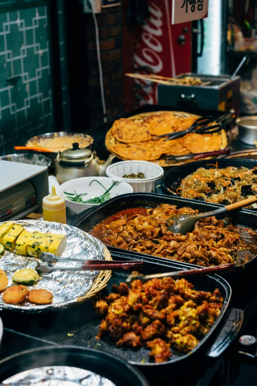 many different types of food sit on tables