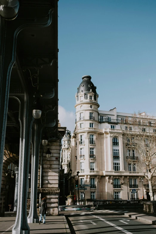 the view of an old building next to a street