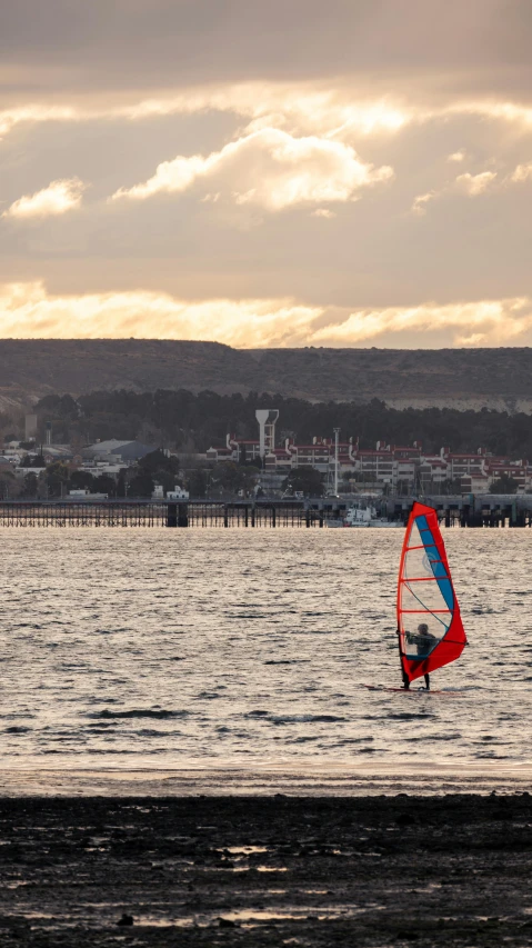 a person para sailing in the water on a cloudy day