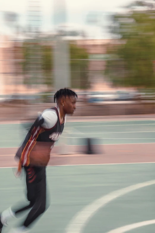 a man running on a tennis court