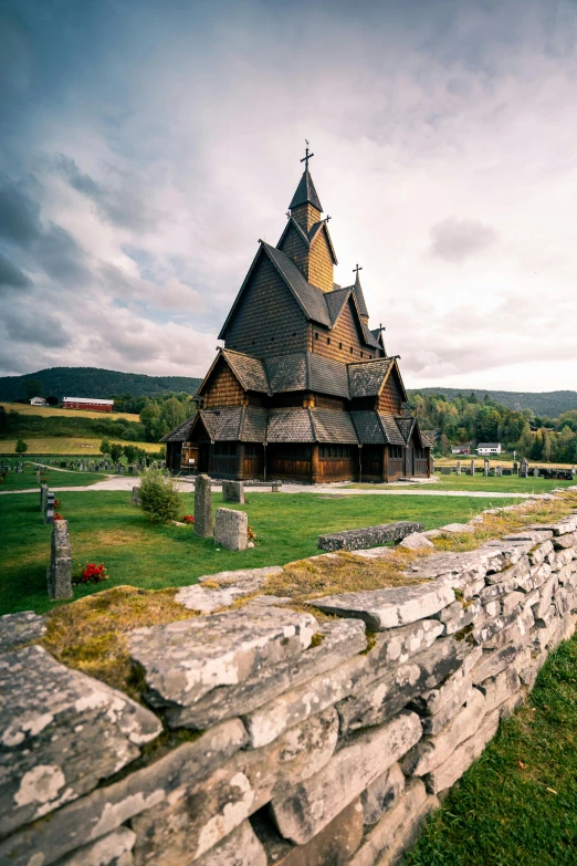 an old church with a tower and stone walls