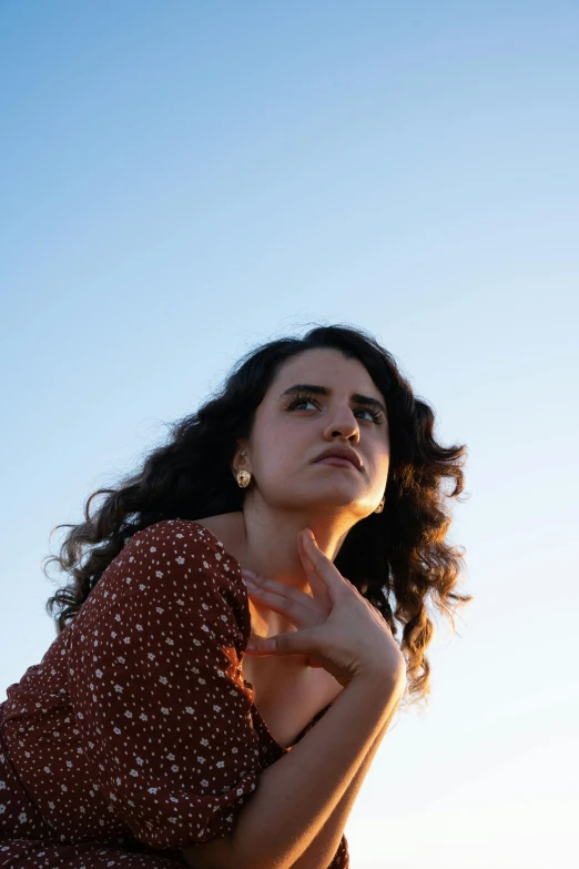 a woman is standing with her arms crossed