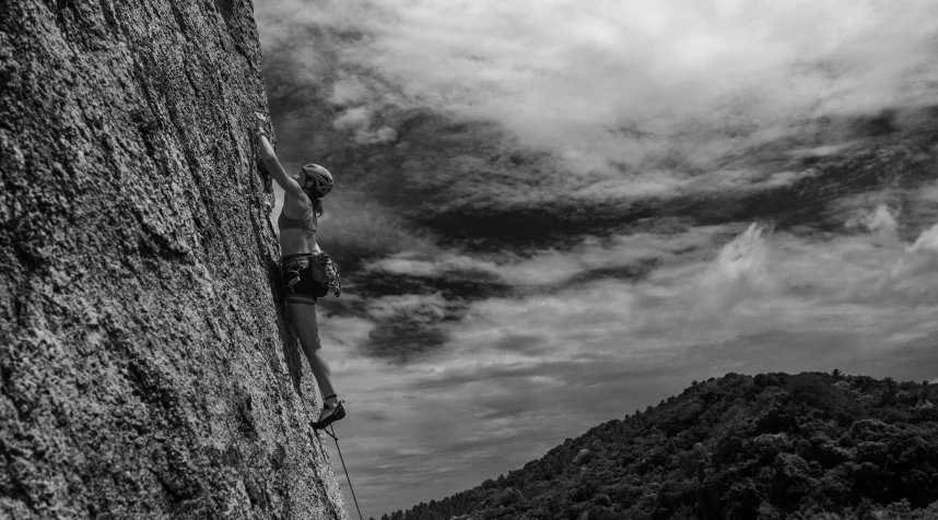 a man standing on top of a rocky cliff