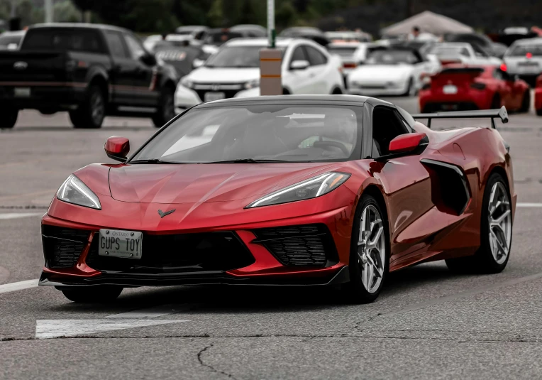 the new sports car sits in a parking lot