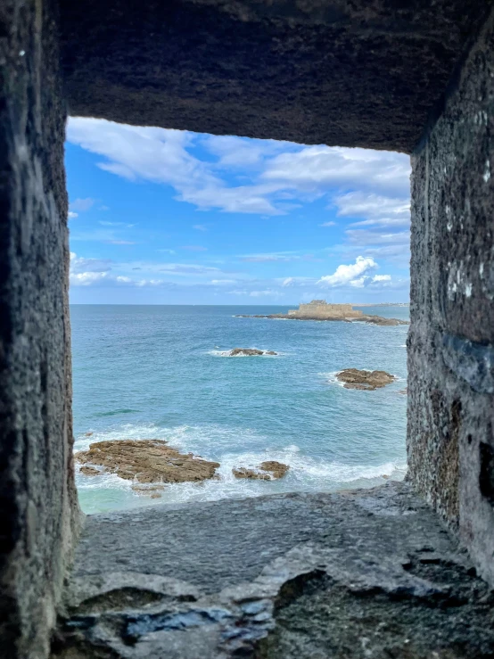 a view out a window into the water