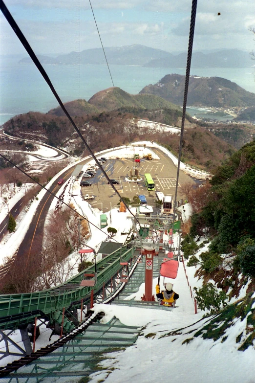 an ski slope that has a train going by