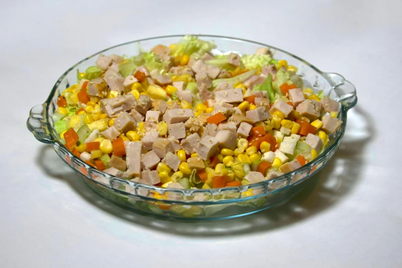 a bowl with different colored vegetables in it