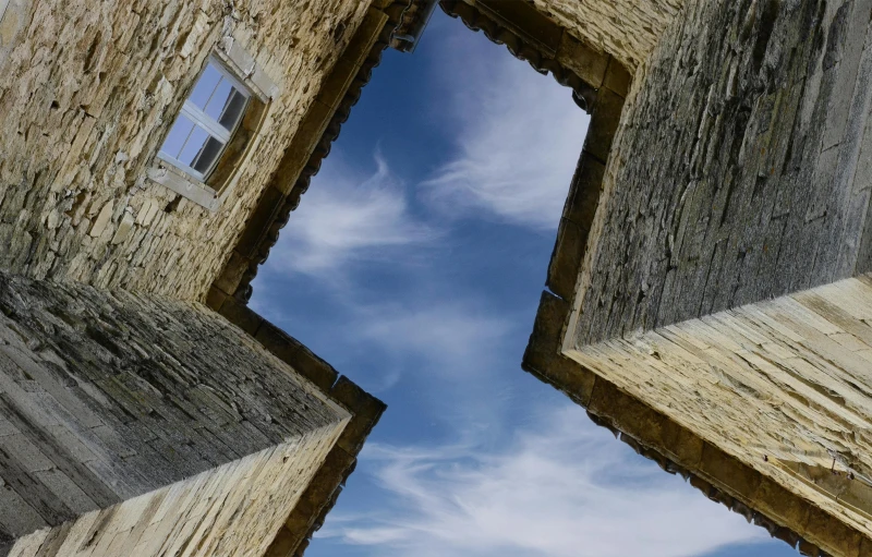 a view of the sky from outside some window in a building