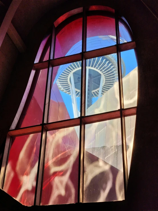an artistic po of the space needle from within a window