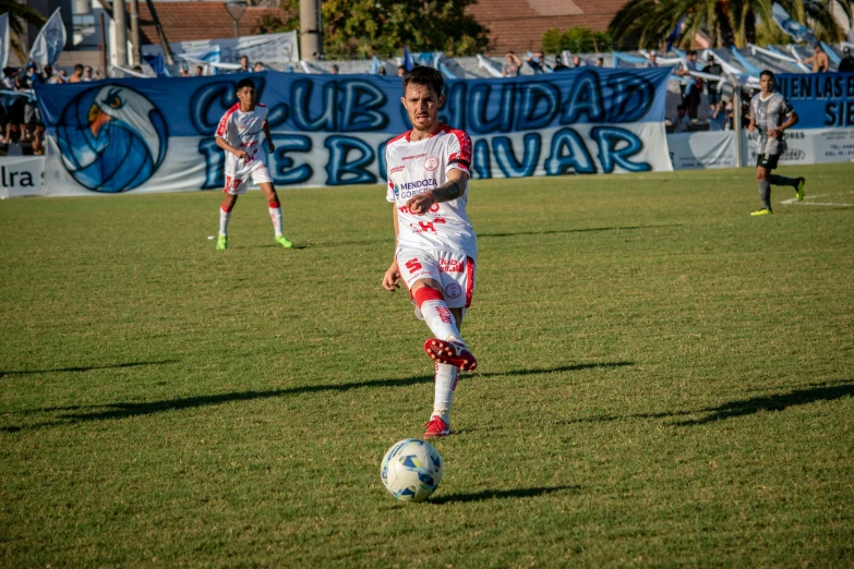 soccer player on field during game with spectators in background