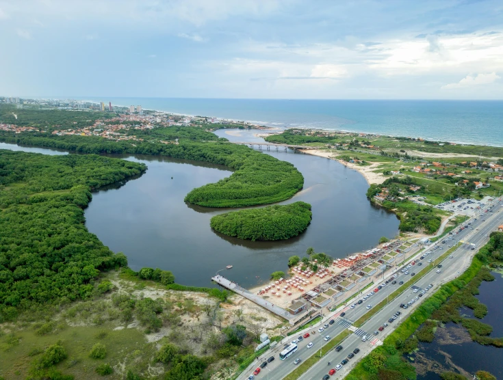 an aerial view of a waterway and roadway