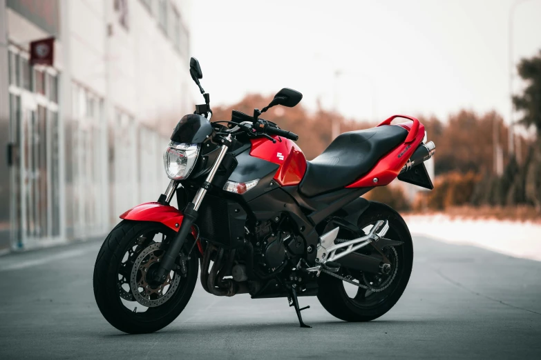 a motorcycle is parked by the building outside