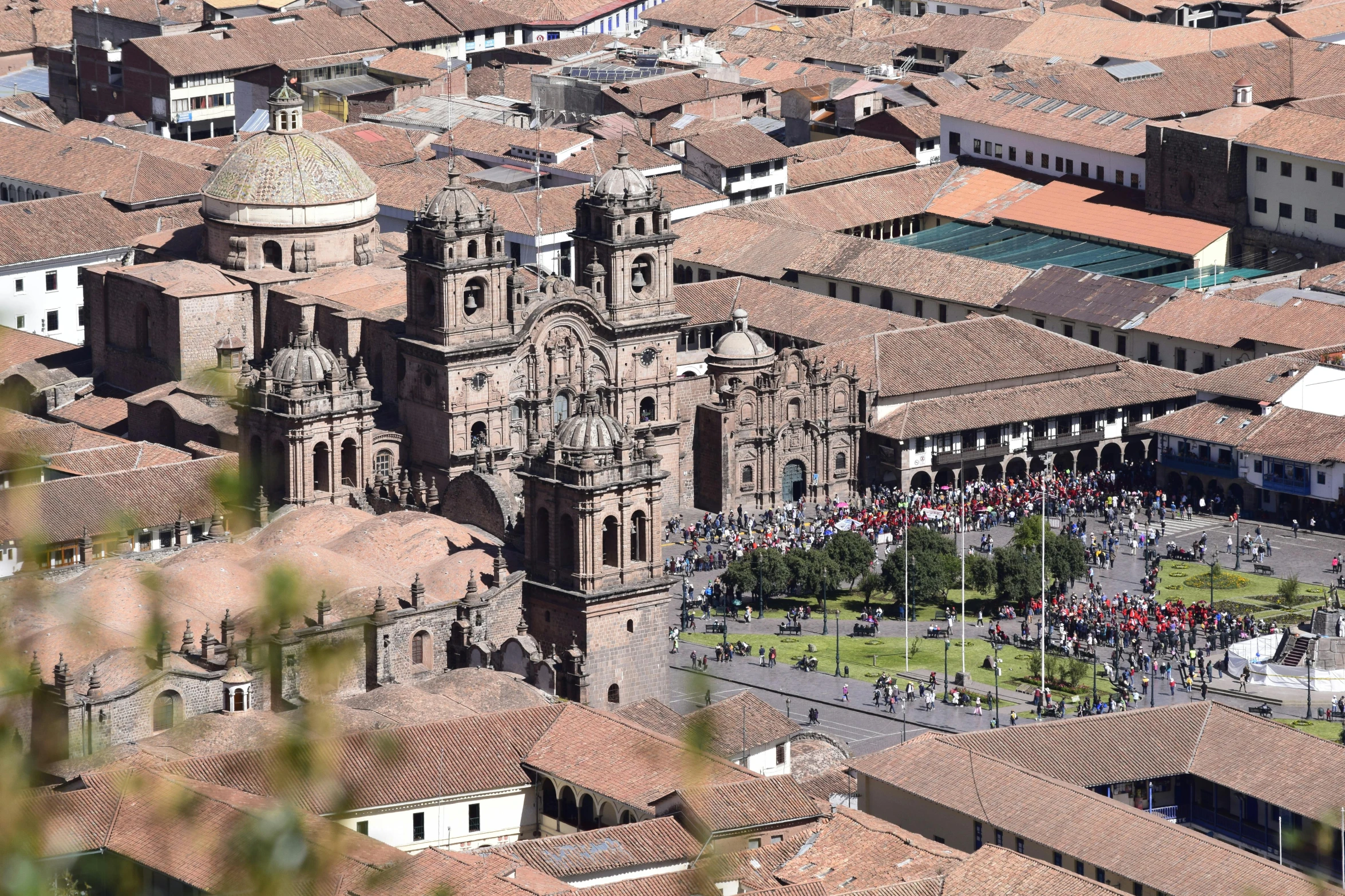 an overhead view of some buildings with people walking around them