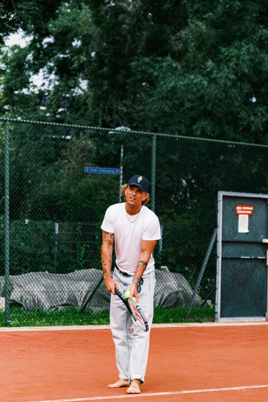 a man with a tennis racket on a court