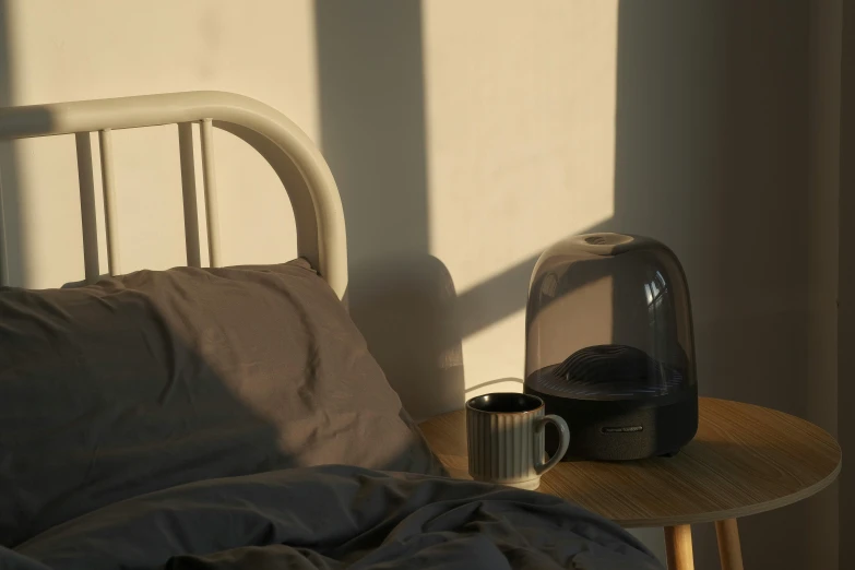 the lamp is next to a bed with a tray on it