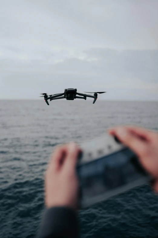 someone taking a po of a flying object from a boat