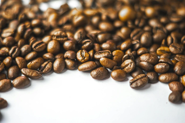 coffee beans are scattered into the shape of a circle