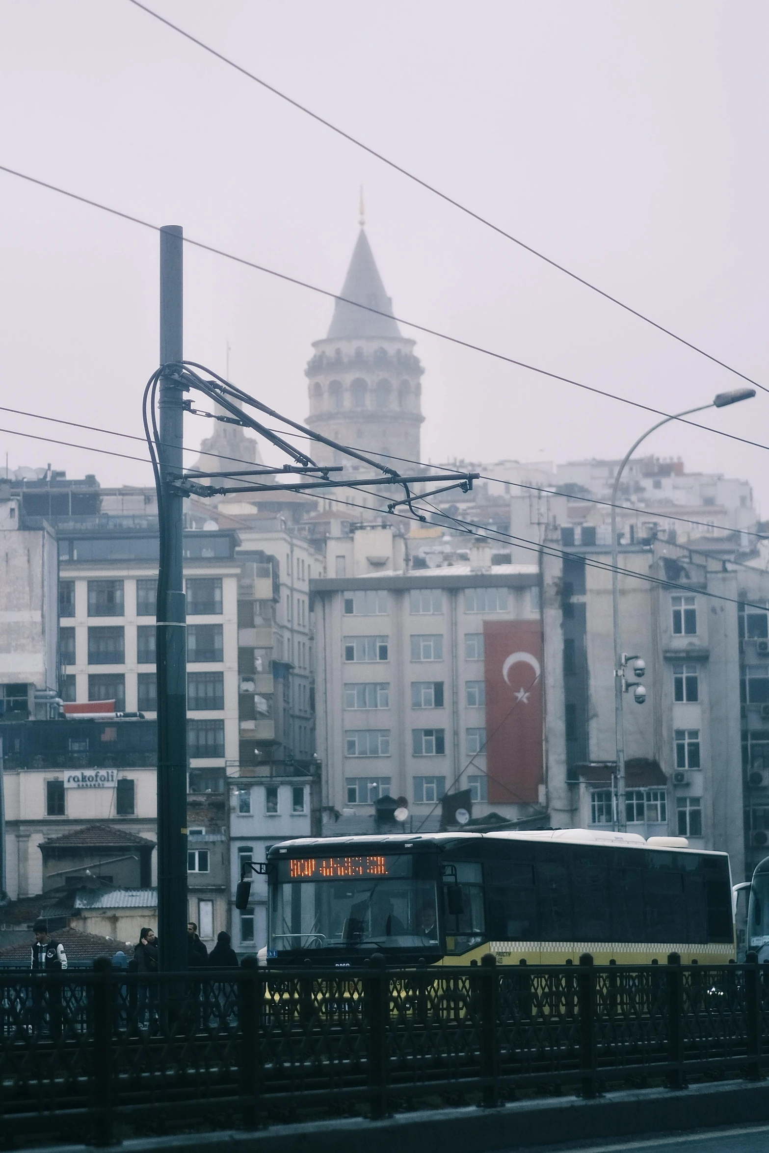 a large city with a train in the foreground