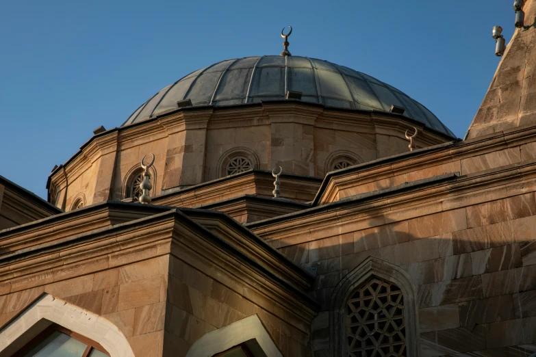 a tall building with a very ornate roof