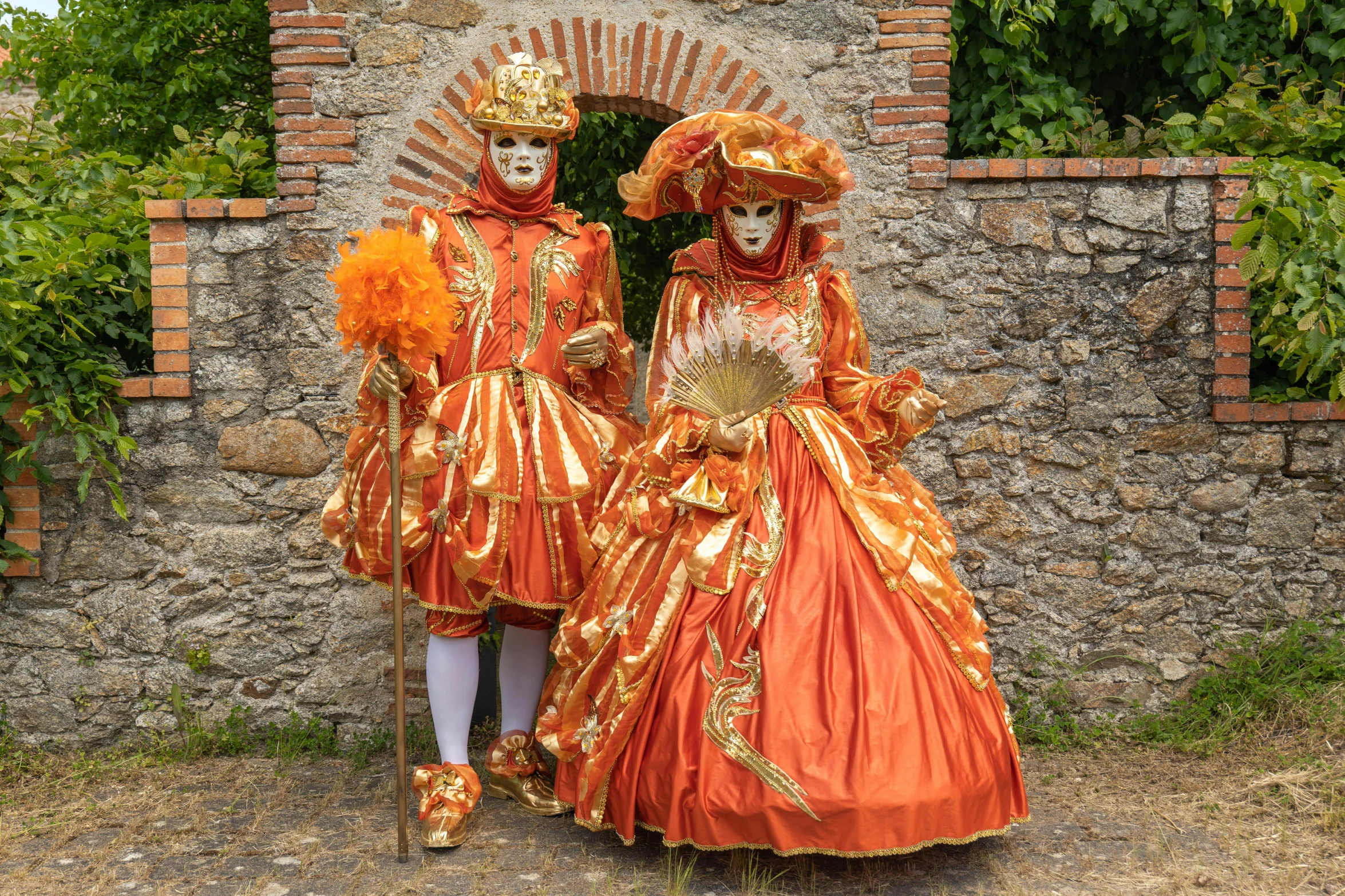 a couple of people in costume standing by a building