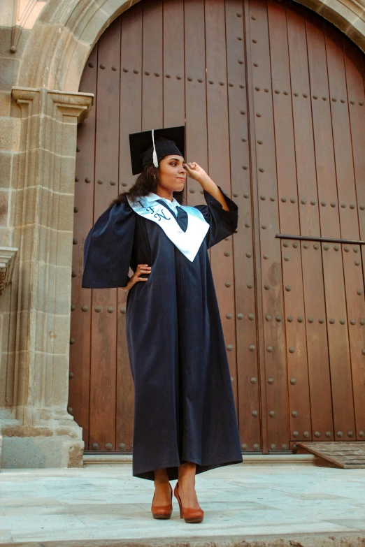 a girl dressed as she is ready to graduate