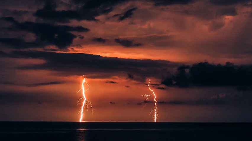 a sky filled with lightning and a long streak