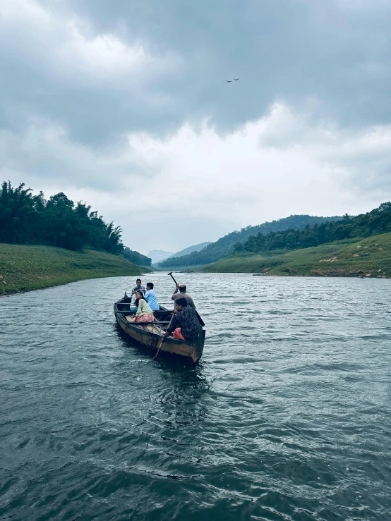 two boats are seen going down the river