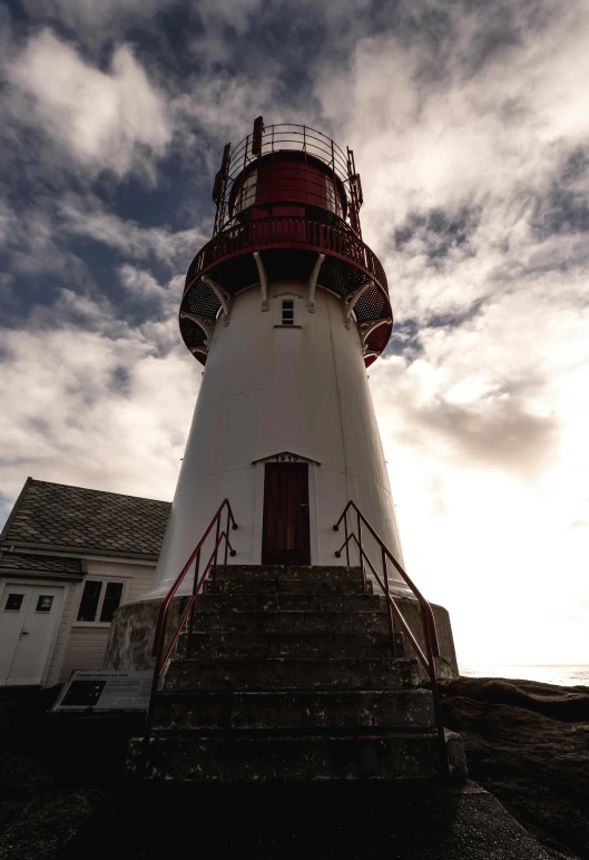 a lighthouse that is in the middle of some steps