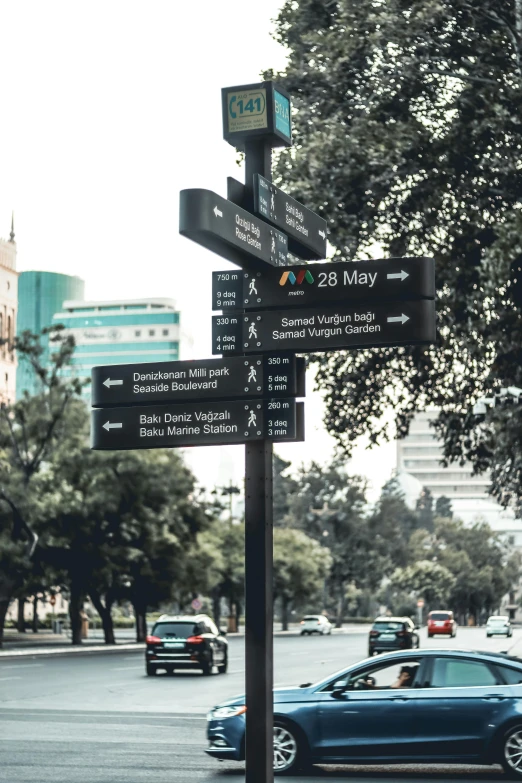 a view of street signs in the center of a city