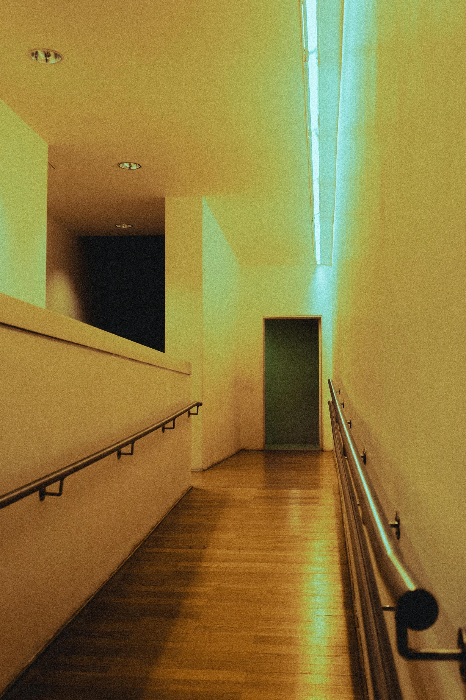 a bright light illuminates the entrance of an empty building