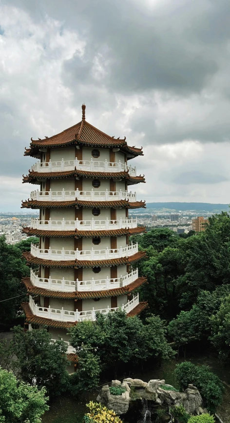 a tall building with many balconies on top