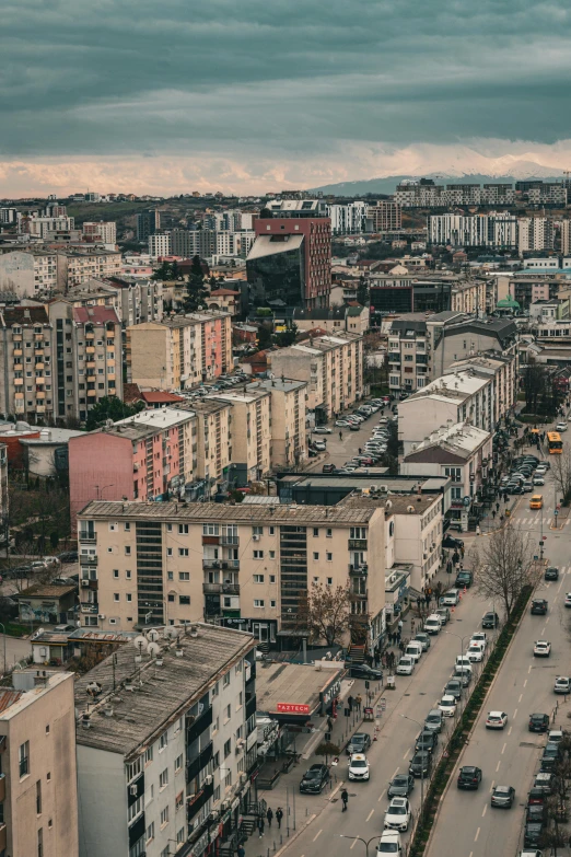 an aerial view of a city street and cars