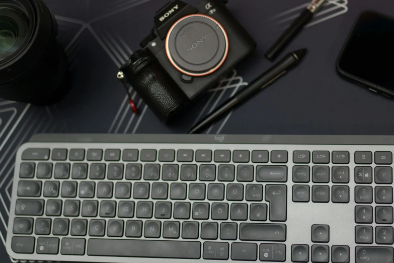 a camera and accessories that are on the table