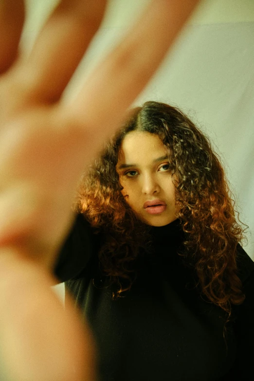 a close up of a woman with curly hair