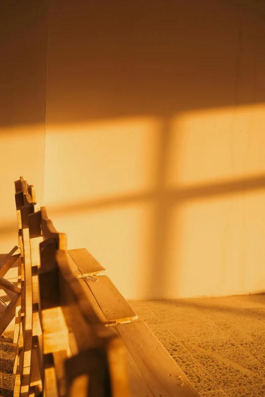 the bench in the room is made from wood